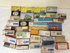 A quantity of cast metal model kits in their original boxes.