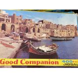 Twenty two opened Good Companion jigsaw puzzles