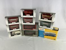 Ten diecast model buses in original packaging