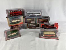 Ten diecast model buses in original packaging