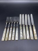 Five knives with silver blades and mother of pearl handles