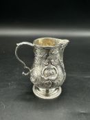 Repousse silver milk jug