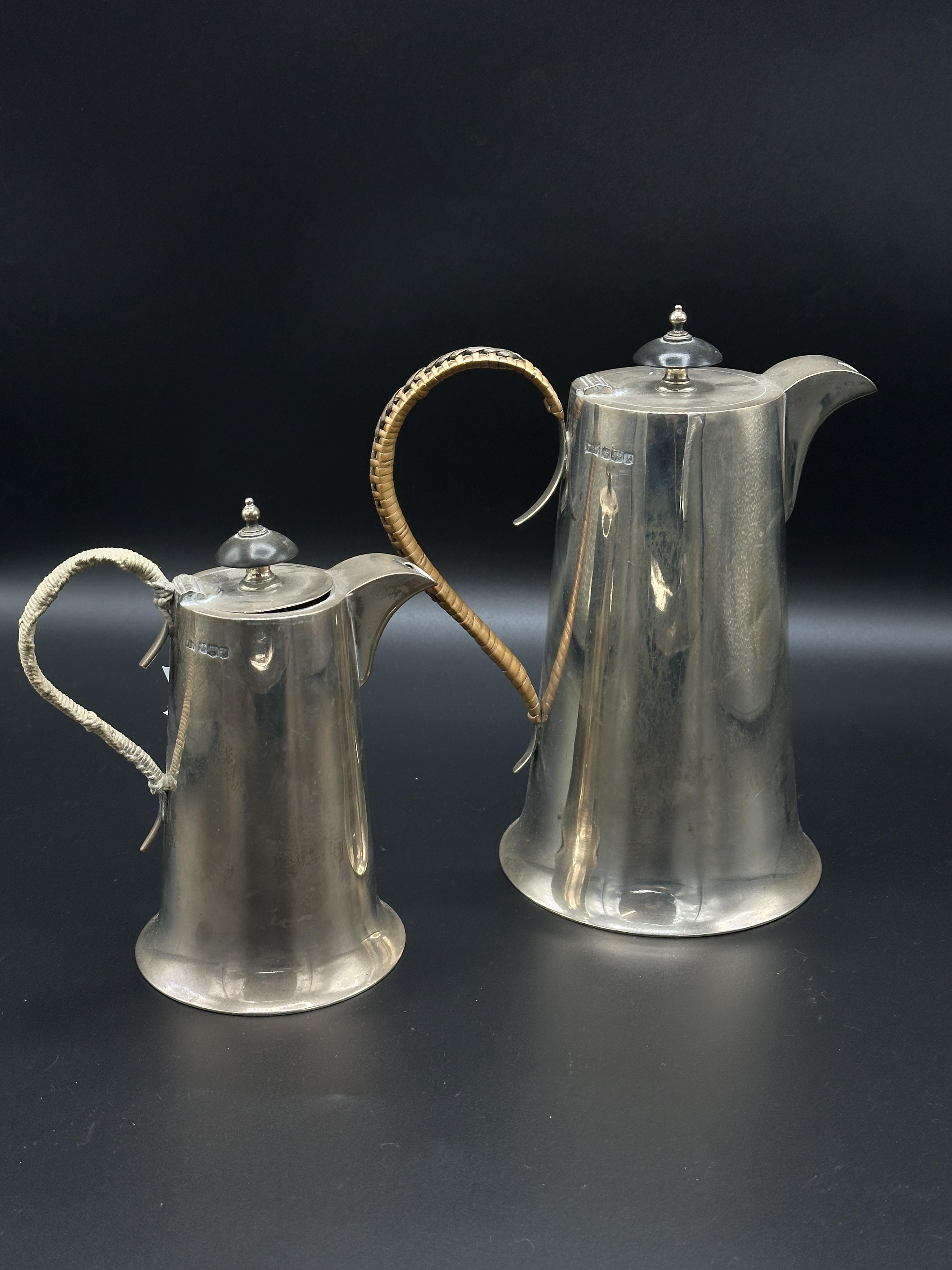 Two silver lidded jugs