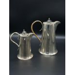 Two silver lidded jugs