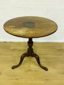 Circular tilt top table