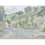 Framed and glazed watercolour of a village street