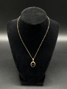 9ct gold and onyx pendant