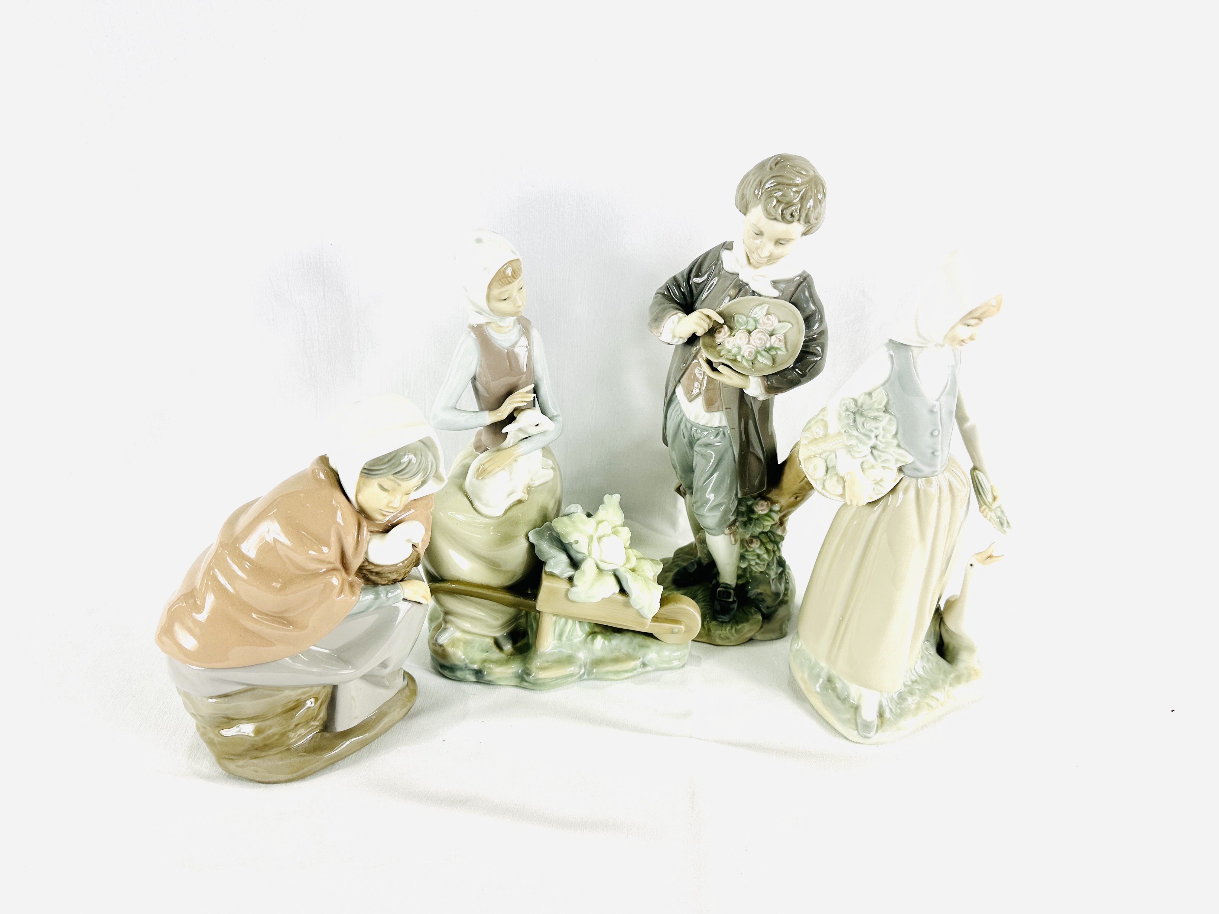 Two Lladro figures and two Neo figures