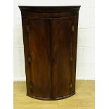 Bow fronted wall mounted corner cabinet