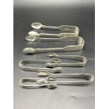 Six pair of silver sugar tongs