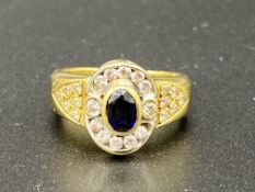 18ct gold ring set with sapphire and diamond ring