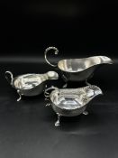 Three silver sauce boats