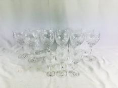 Eleven crystal wine glasses together with six liqueur glasses