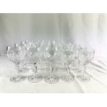 Twelve white wine glasses, together with eight crystal dessert wine glasses.