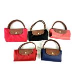 Five Longchamps fold out canvas bags with leather trim