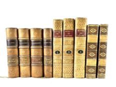 Five leather bound and four quarter bound books