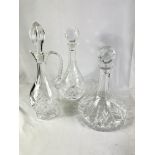 Two crystal decanters together with a ships decanter