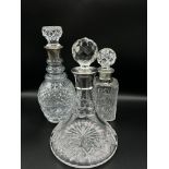 Collection of cut glass and silver decanters