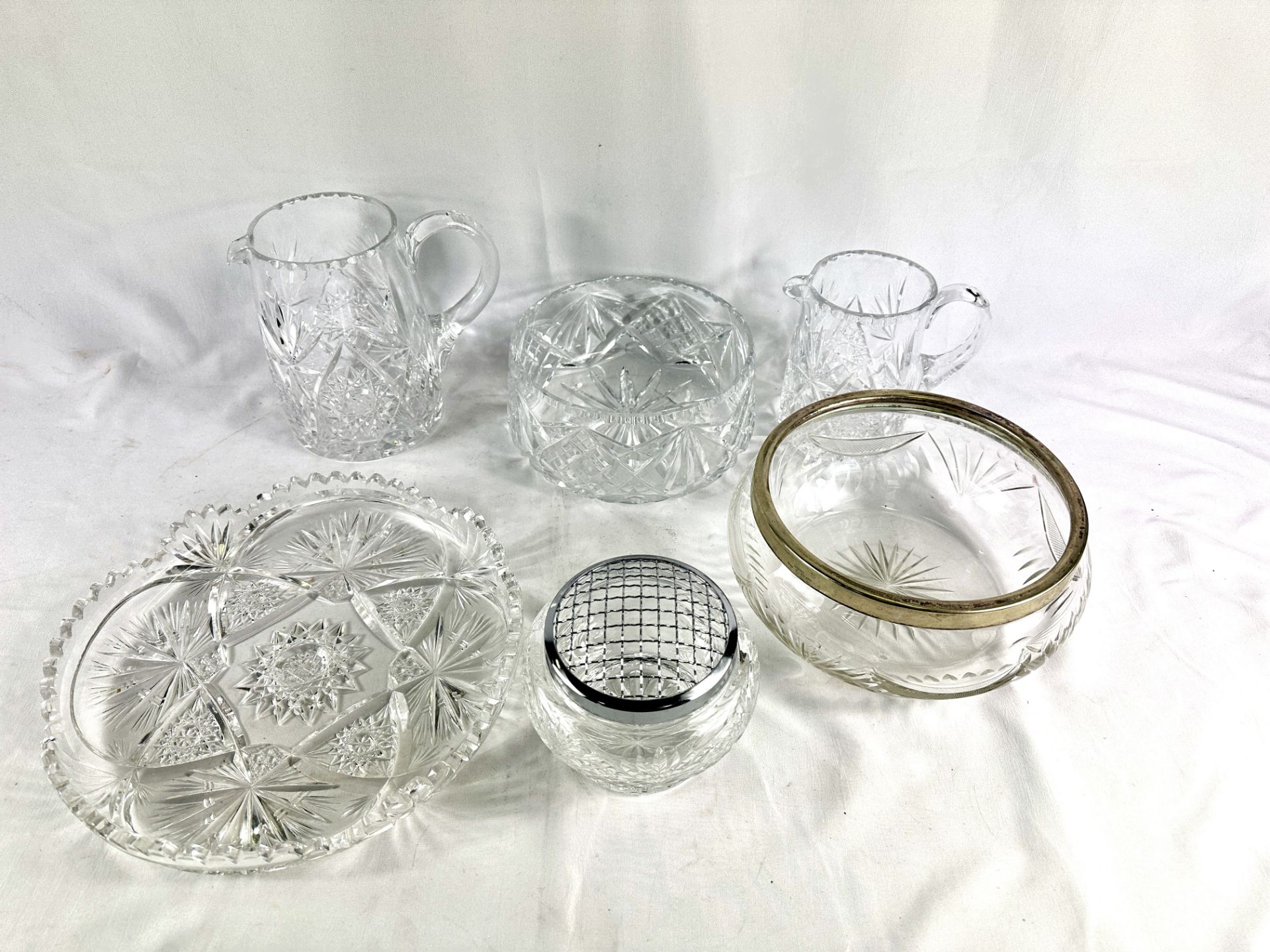 Two crystal water jugs and other crystal glassware