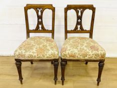 Two oak dining chairs