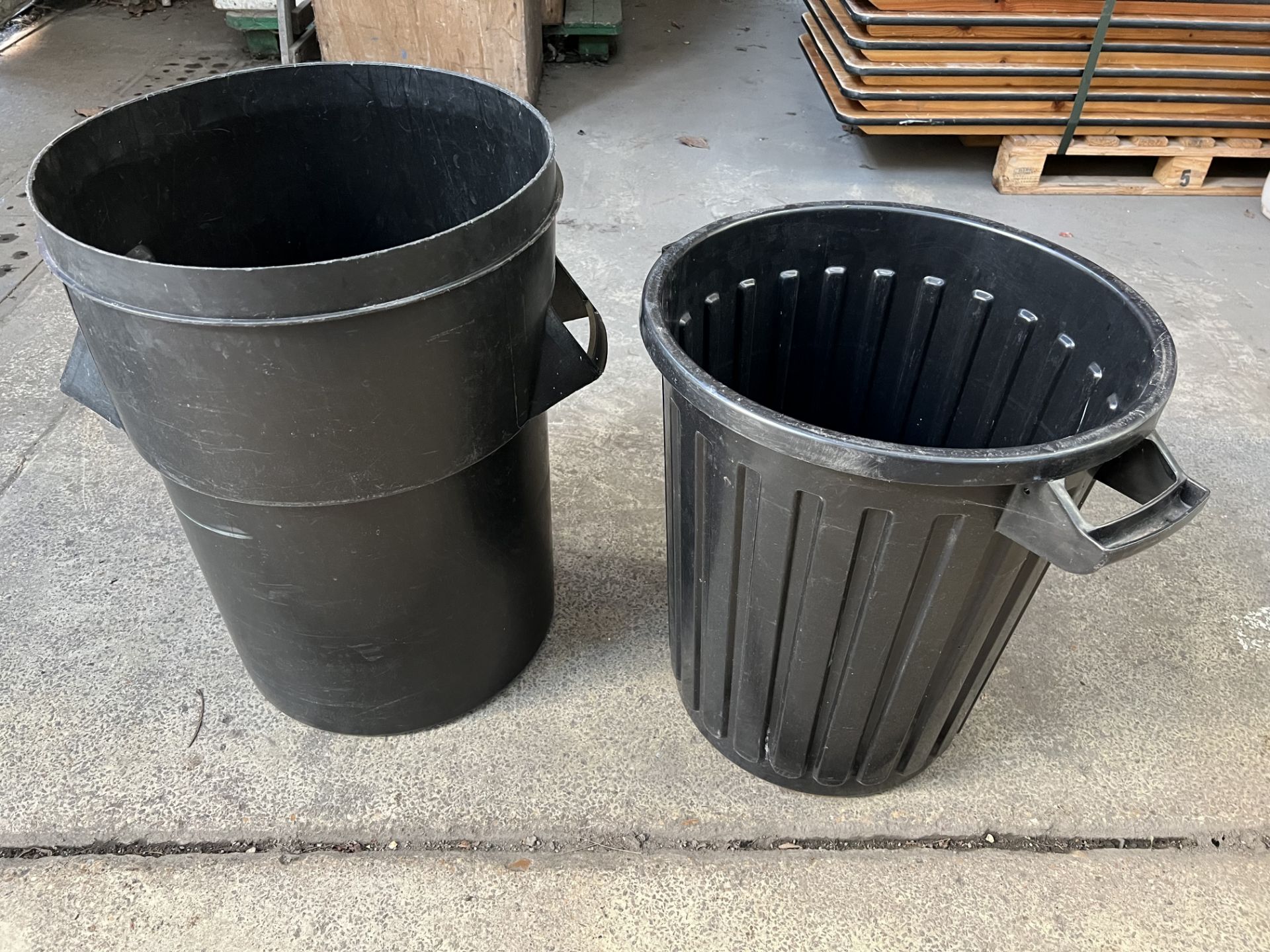 16 black plastic dust bins. This lot is subject to VAT.