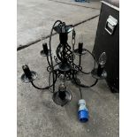 5 light black wrought iron chandelier; with ten spare new bulbs. This lot is subject to VAT