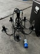 5 light black wrought iron chandelier; with ten spare new bulbs. This lot is subject to VAT