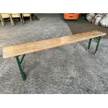 10 no 6ft long wooden benches with metal folding legs. This lot is subject to VAT