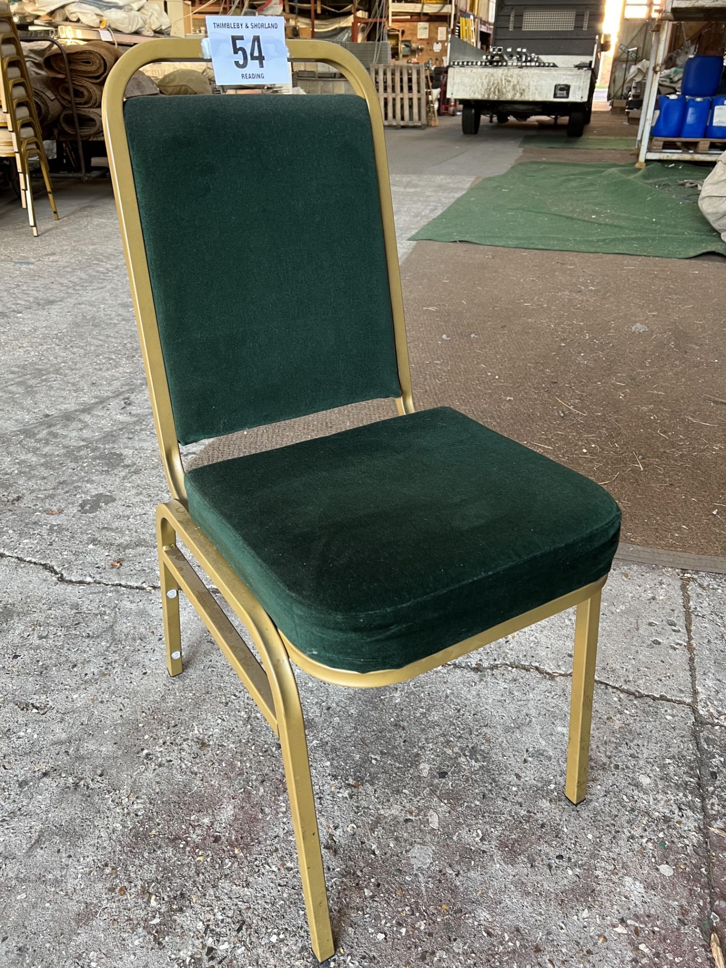 27 banquet chairs with green seat and back. This lot is subject to VAT