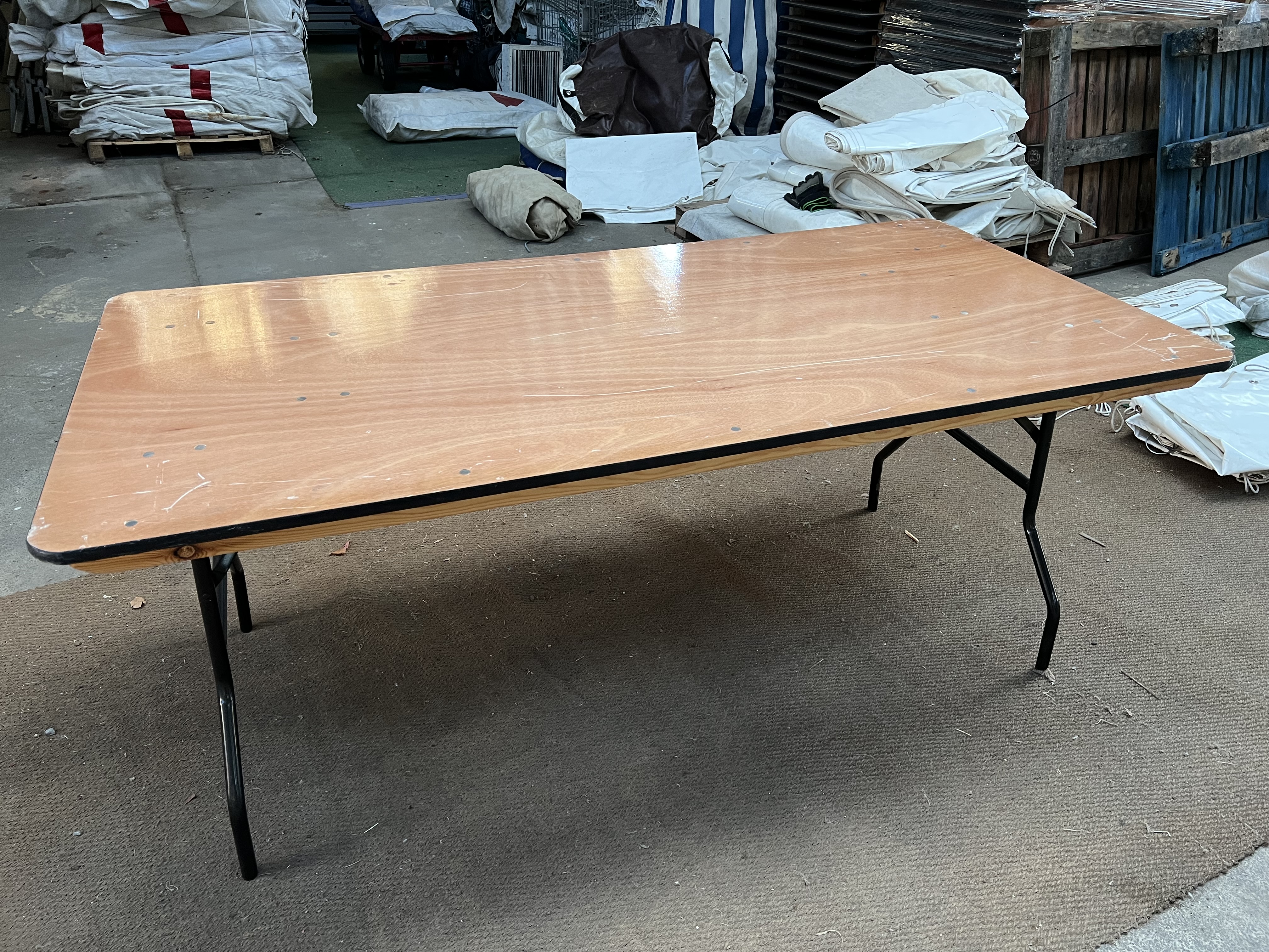 27 no 6ft x 3ft trestle tables with metal folding legs and plywood top. This lot is subject to VAT