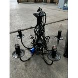 5 light black wrought iron chandelier; with ten spare new bulbs. This lot is subject to VAT