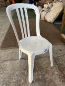 50 white resin bistro chairs. This lot is subject to VAT