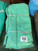 15ft x 9ft green cotton tarpaulin, hemmed, eyeletted and with ropes. This lot is subject to VAT