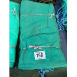 15ft x 9ft green cotton tarpaulin, hemmed, eyeletted and with ropes. This lot is subject to VAT