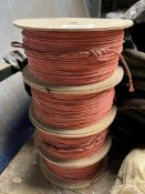 Four coils of red polypropylene rope, 7mm x 500m. This lot is subject to VAT