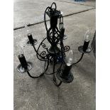 5 light black wrought iron chandelier; with ten spare new bulbs. This lot is subject to VAT