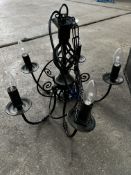5 light black wrought iron chandelier; with ten spare new bulbs. This lot is subject to VAT