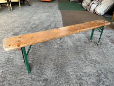 10 no 6ft long wooden benches with metal folding legs. This lot is subject to VAT