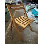 50 wooden slatted folding chairs. This lot is subject to VAT