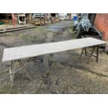 Approximately 50, 10ft and approximately 20, 6ft wooden trestle tables. This lot is subject to VAT