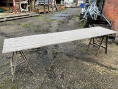 Approximately 50, 10ft and approximately 20, 6ft wooden trestle tables. This lot is subject to VAT