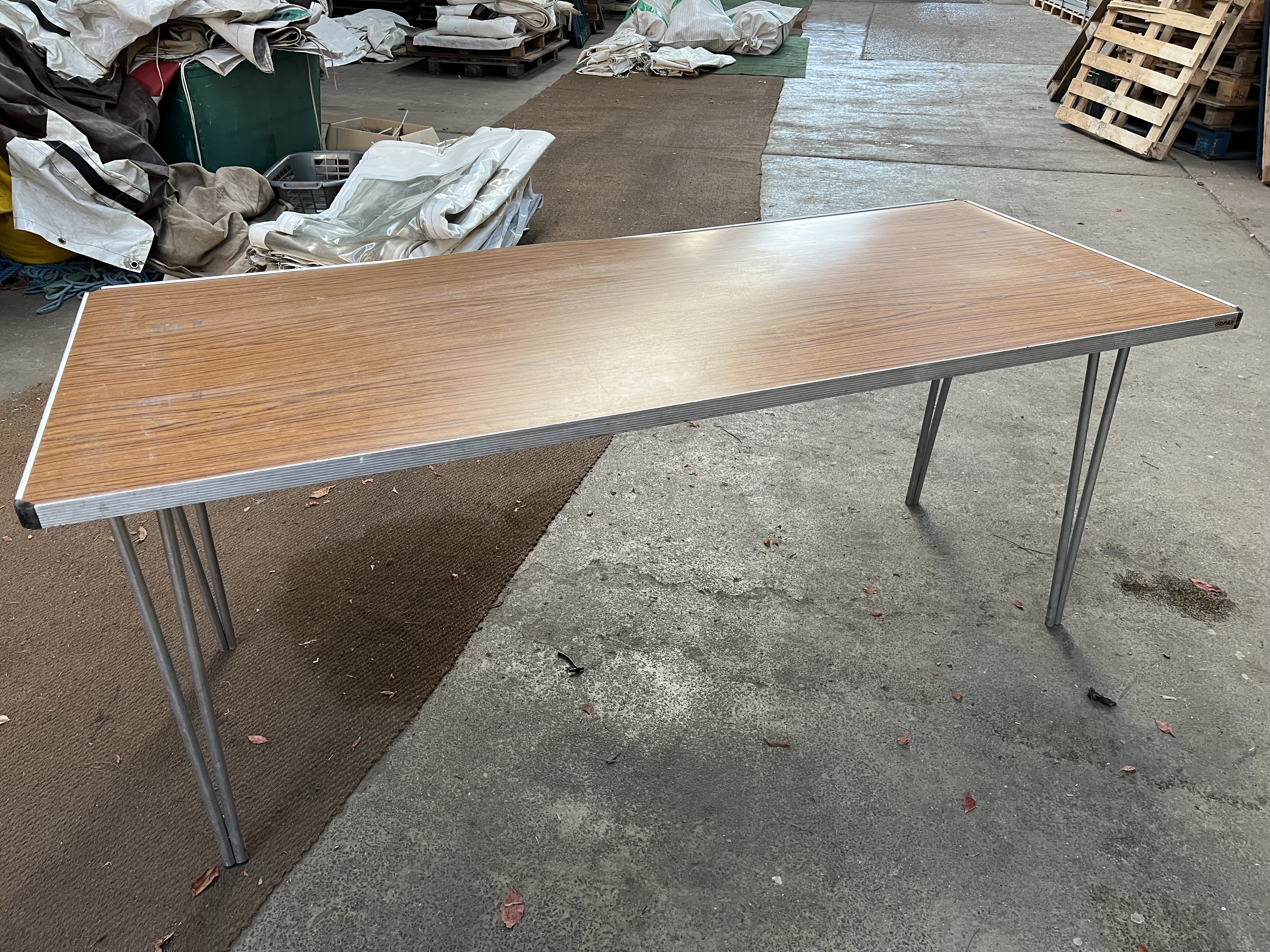 15 Gopak 6ft trestle tables with folding legs and melamine top. This lot is subject to VAT.