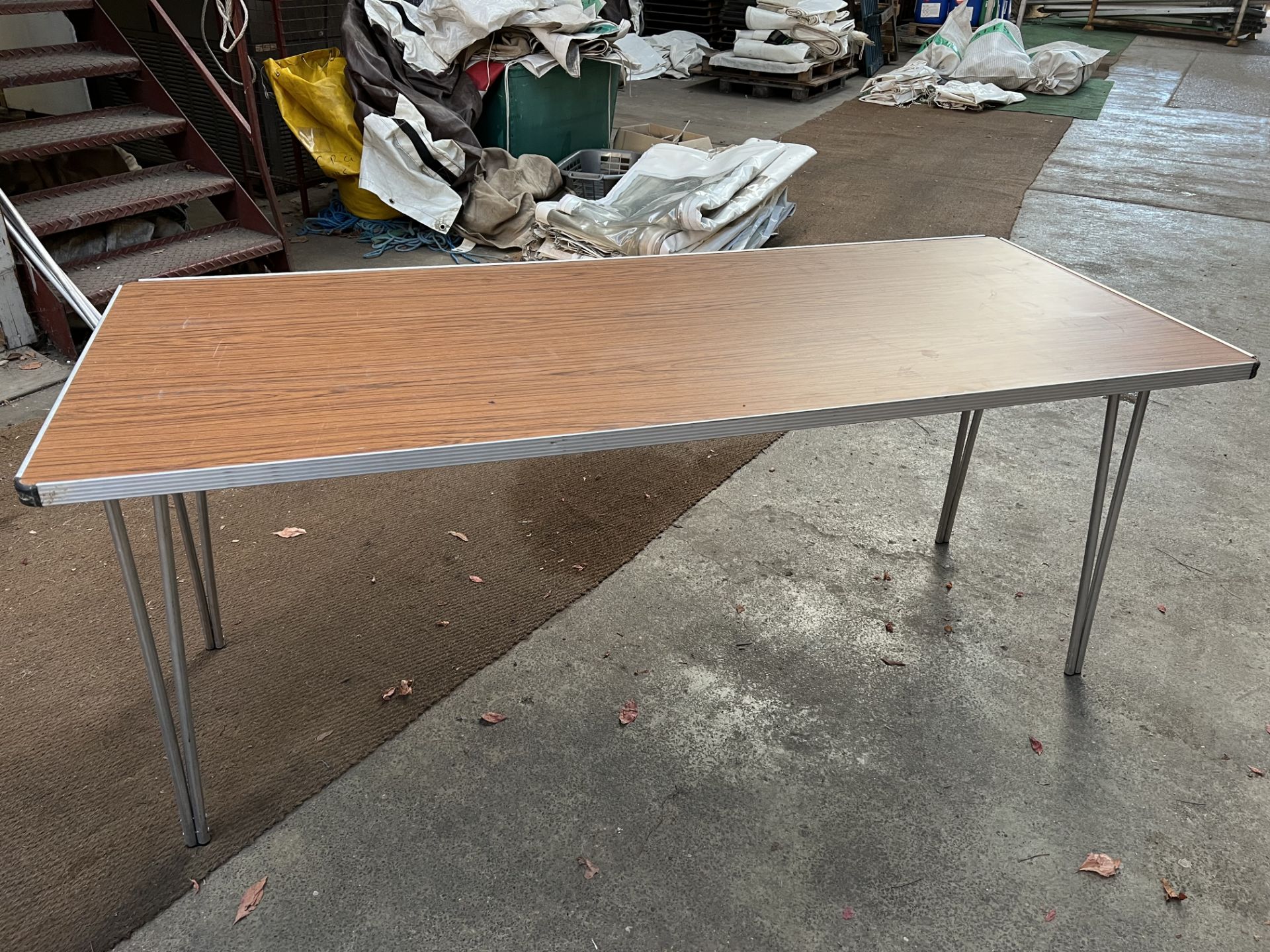 15 Gopak 6ft trestle tables with folding legs and melamine top. This lot is subject to VAT.