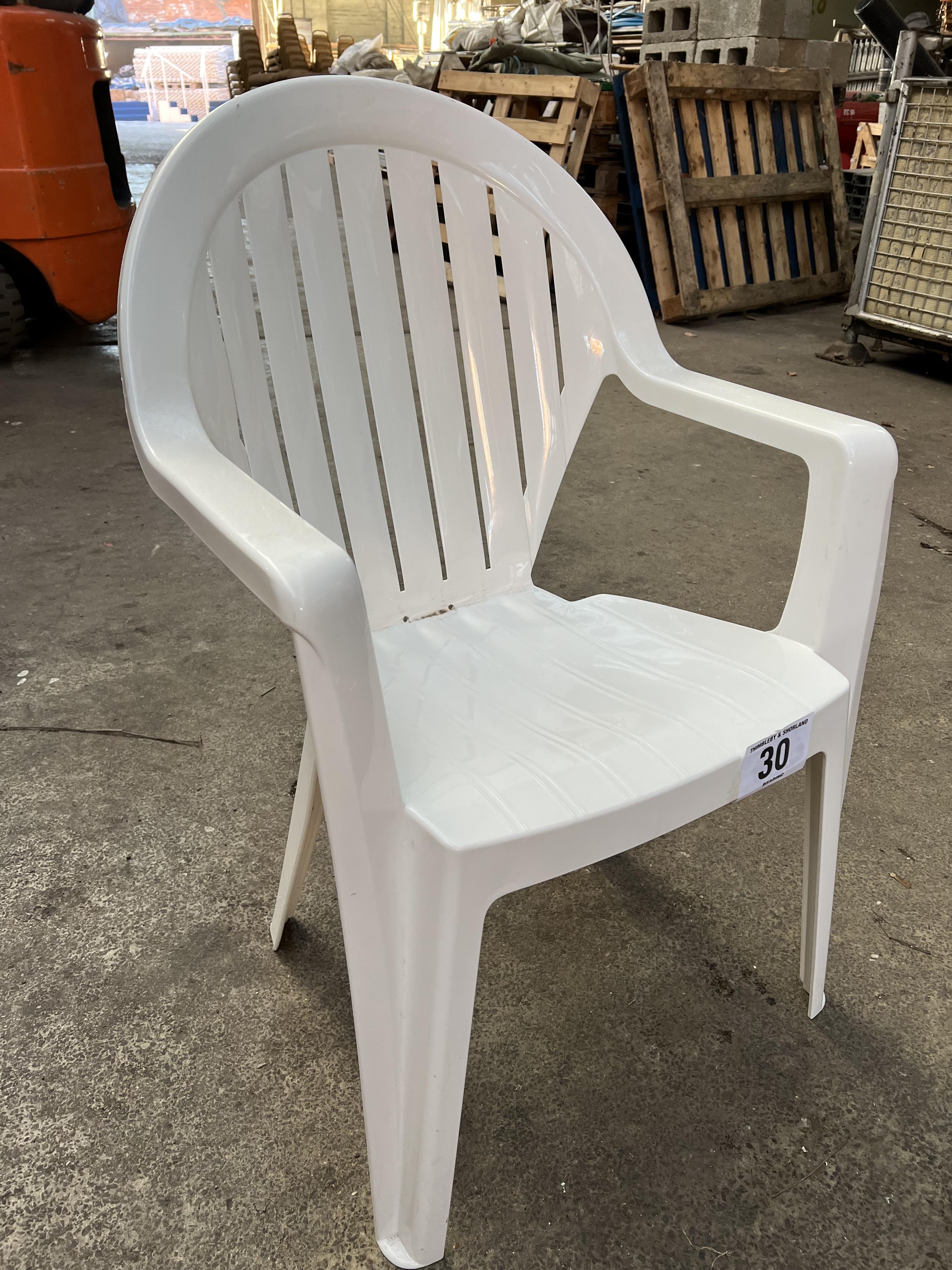 50 white resin garden armchairs. This lot is subject to VAT