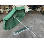 5 no 1.5m diameter green garden umbrellas. This lot is subject to VAT