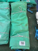 12ft x 12ft green cotton tarpaulin, hemmed, eyeletted and with ropes. This lot is subject to VAT