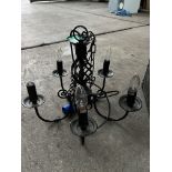 5 light black wrought iron chandelier; with ten spare new bulbs. This lot is subject to VAT