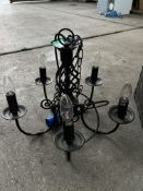 5 light black wrought iron chandelier; with ten spare new bulbs. This lot is subject to VAT