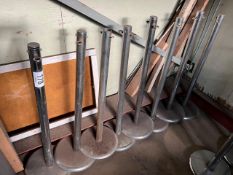 8 chrome stanchions, height 102cms. This lot is subject to VAT