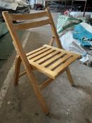 50 wooden slatted folding chairs. This lot is subject to VAT